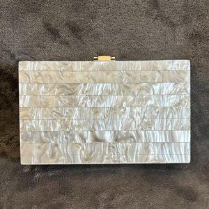 Acrylic pearl clutch with convertible crossbody chain